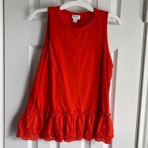 100% cotton orange tunic top with eyelet hem.